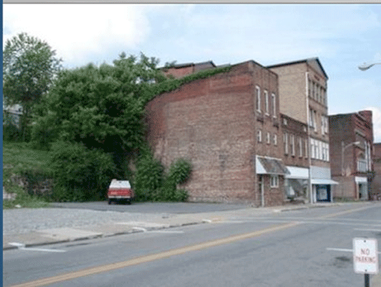 Photographs below of the building before construction and the coffee shop 